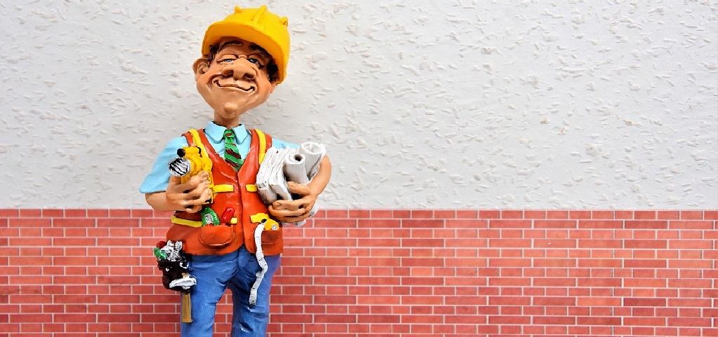 guy miniature with architect tools